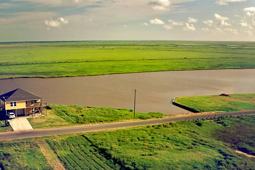 view of house from beach with a drone. The wildlife refuge is out our backdoor. So secluded!