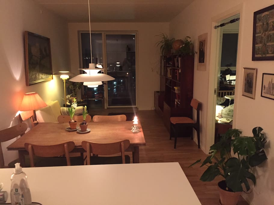 From kitchen: dining area and living room, including balcony door.