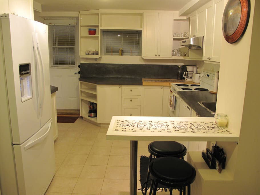 HUGE FULLY EQUIPPED KITCHEN WITH BREAKFAST BAR