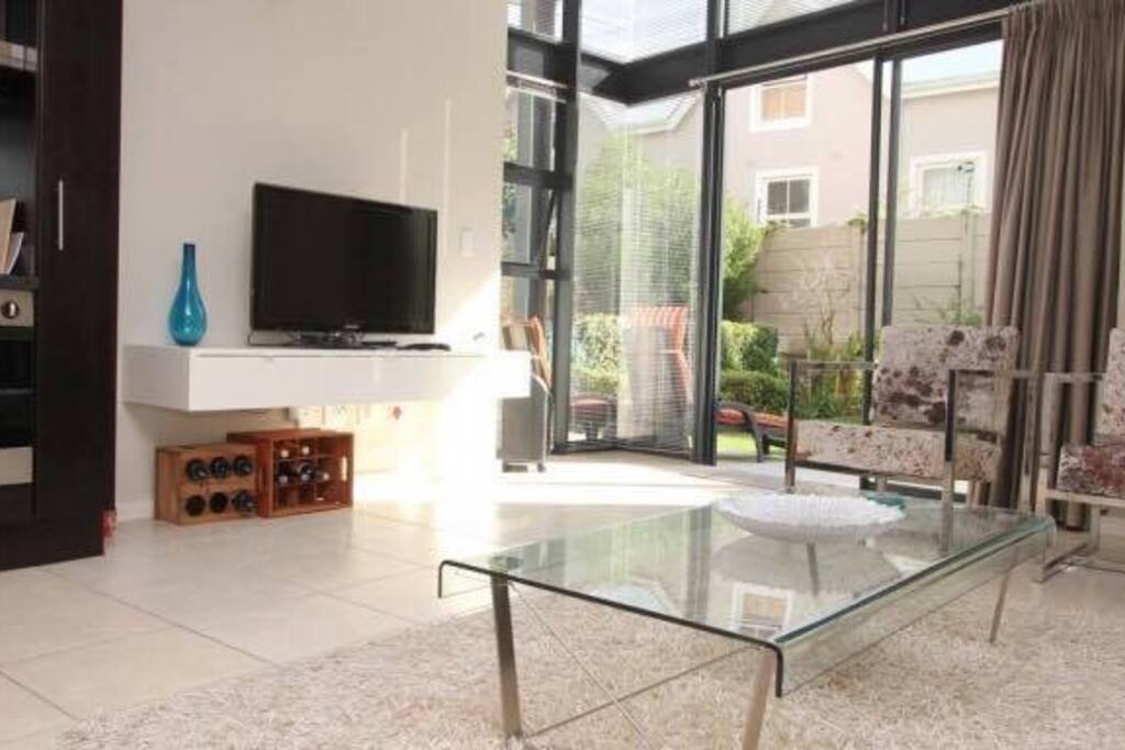 Lounge seating area with flat screen TV and DSTV