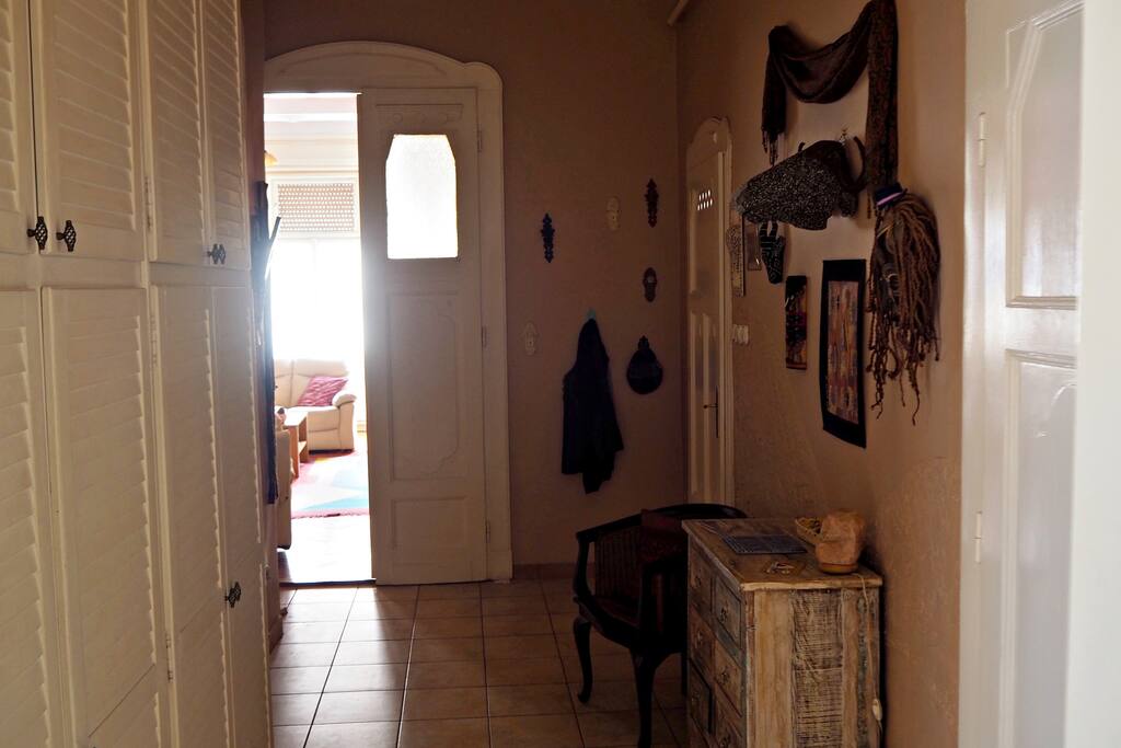 The entire apartment is filled with mementos of our travels, the hallway is no exception.