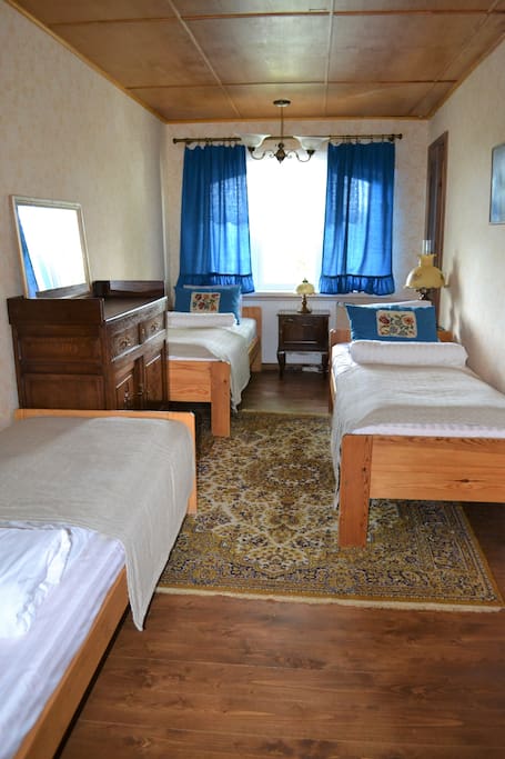Room has three single bed.