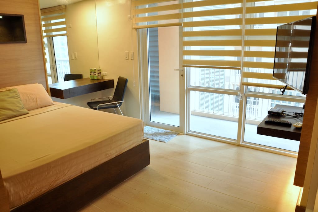 Queen Size bed, comfortable mattress, work area, balcony with rolled-up blinds for privacy
Fiber Internet, HD Cable TV