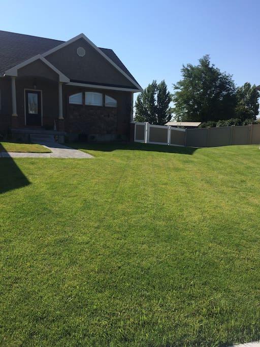 Yard where camper will sit, access to fenced back yard.