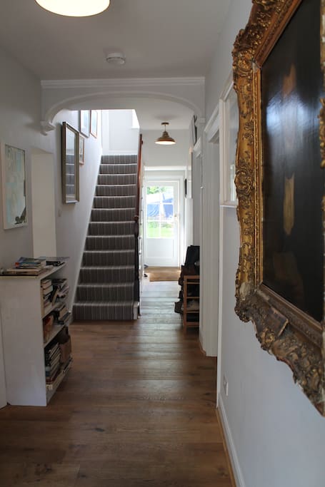 The Hall: 'Sunny Room' is up these stairs, on the left.