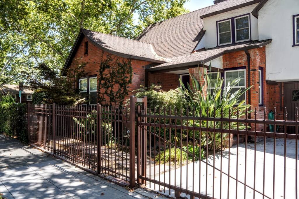 Front view from S St. Built in 1937. The entire lower unit is your separate, private, personal space. If you look closely, you can see the front door (purple) past the Bird-of-Paradise.
