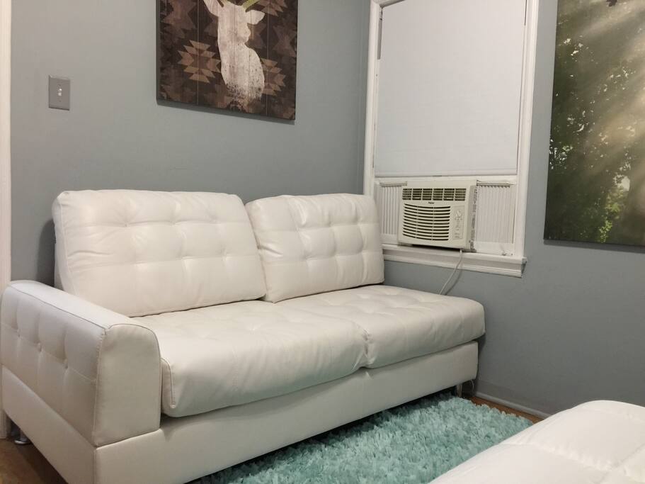 Comfy couch in bedroom