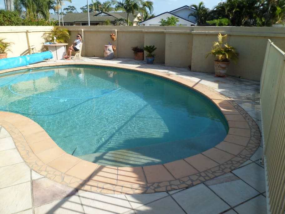 private walled sunny walled swim pool area that your queen size bdrm looks on to.