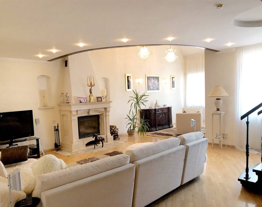 Living room with big sofa and fireplace