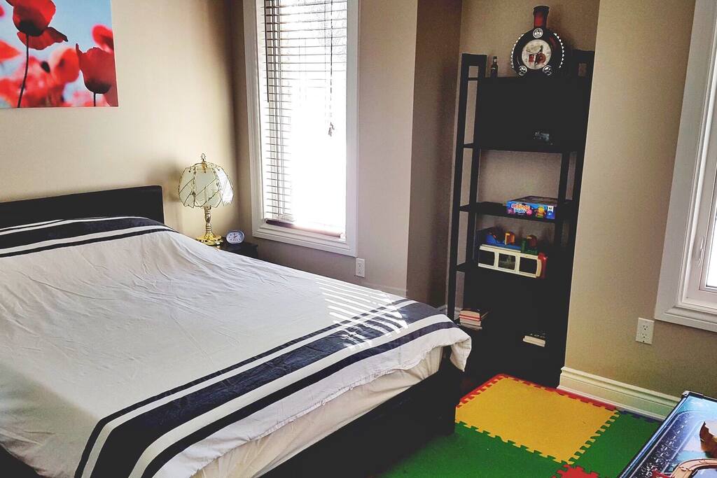 Master Bedroom with In Suite Washroom and Queen Size Bed,Mirror Sliding Doors Closet, Play Table for Kids will open up the Green backyard through 2 tall windows, for watching the squirrels play.