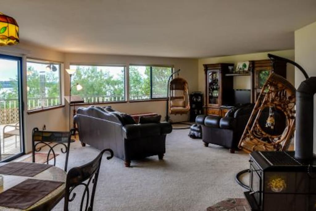 OPEN DINING AND LIVING AREAS WITH WALLS & DECK OVER THE OCEAN