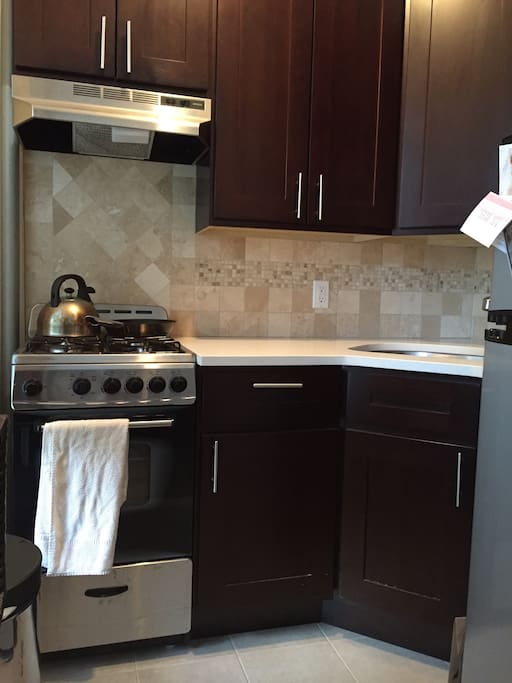 Recently updated kitchen includes all needs for basic cooking (pots, pans, flatware, cups, etc) as well as staple spices/sauces/condiments.