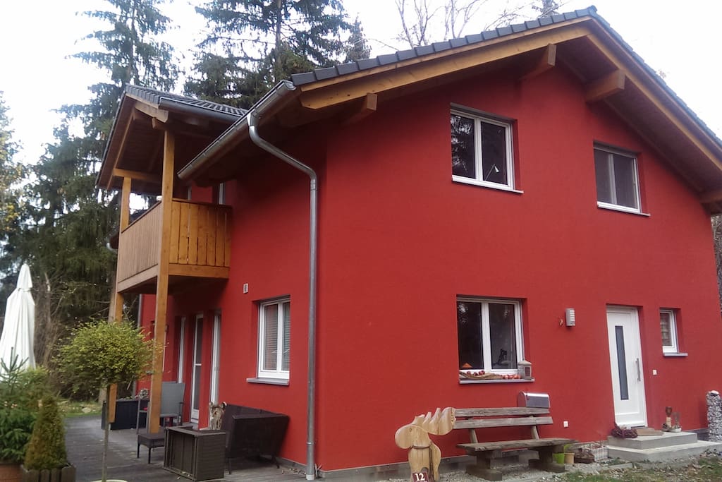 Red, cute house, 3 sides in the woods
