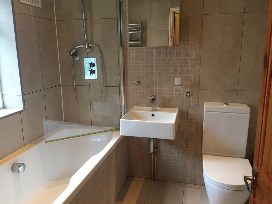 Lovely tiled bathroom in neutral decor