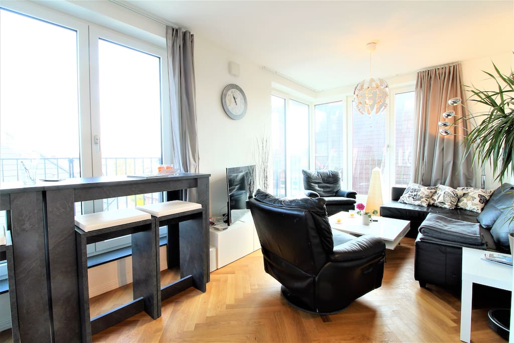 Beautifully designed living area with connection into the dining area.