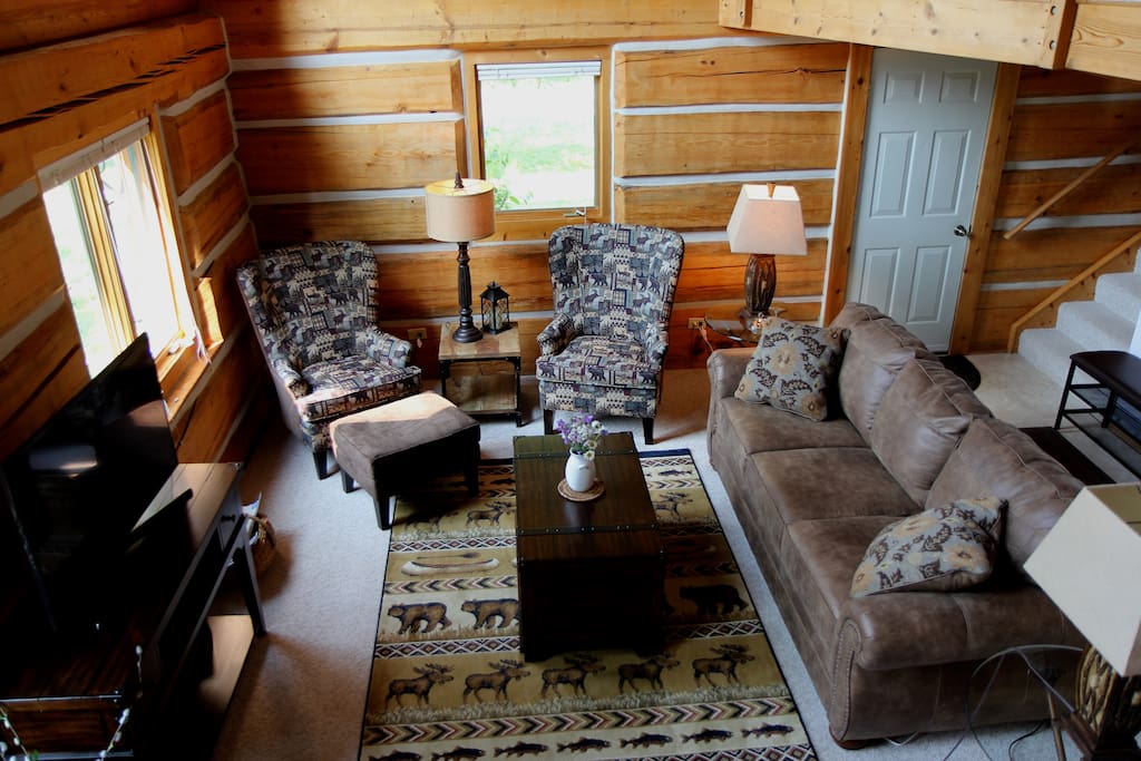 The cozy living room is bathed by the sun during the day and caressed by the moon and stars at night.