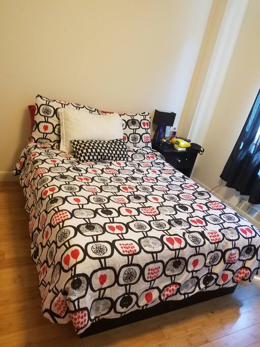 Comfortable bedroom with TV and toddler bed