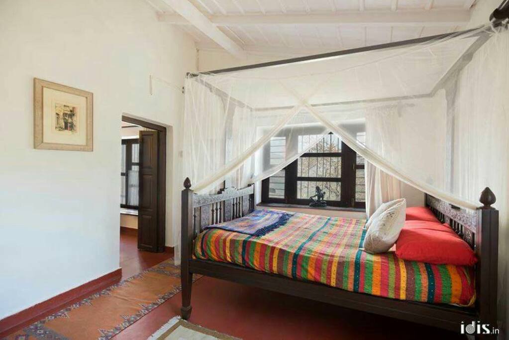 Calcutta poster beds with nets add to the romantic set up of the place.