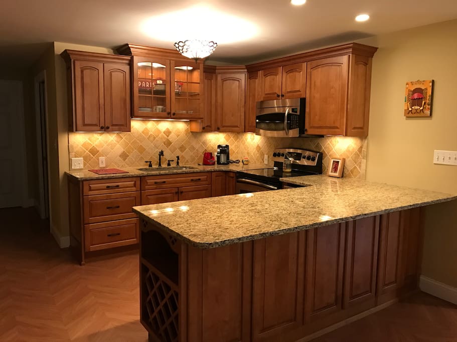 Enjoy a full kitchen with granite counter tops, ice maker, mini-fridge, stove and microwave.