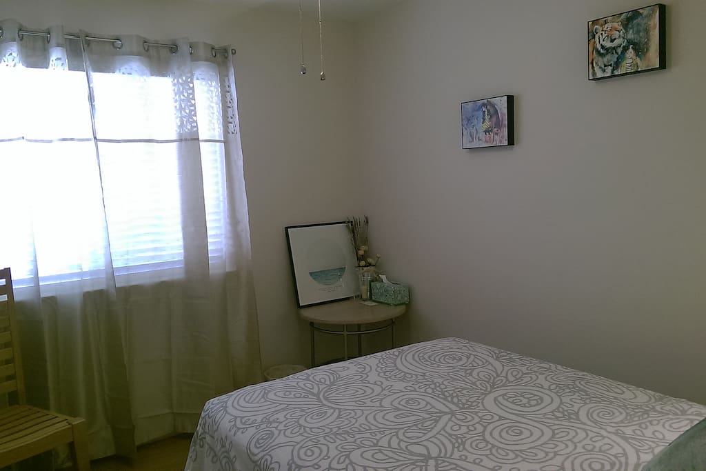Full size bed with organic bamboo deep mattress on new bamboo hardwood flooring.
