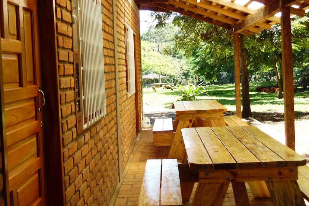 Private terrace outside group room with wooden picnic table