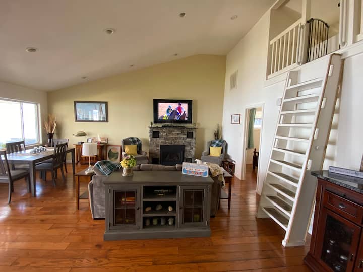 The main gathering area. From the left, dining table seating 6 (we put the armchairs at the ends), a pull-out Queen sofa bed, the third bedroom and the loft is on the right up the ladder (has a double bed).