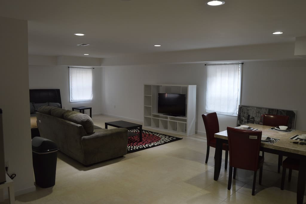 Dining and living area with 48" tv and marble dining table