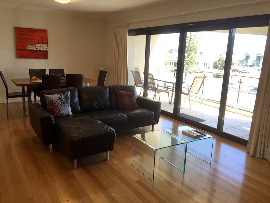 Large sitting and dining area with wide balcony. The north aspect is great for sun in summer and shade in winter