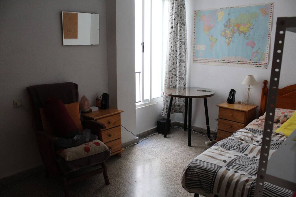 Bedroom. Bed, beddings, armchair, table & chair