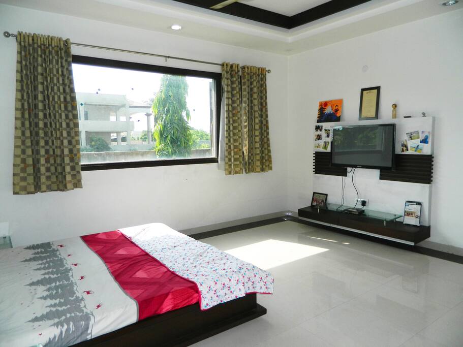 Bedroom with a view of a huge garden outside