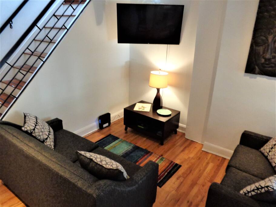 The living area has 2 sofa beds, comfortably accommodating 4 additional guests.
