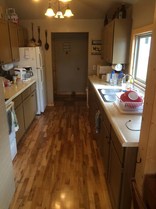 furnished galley style kitchen with electric appliances
