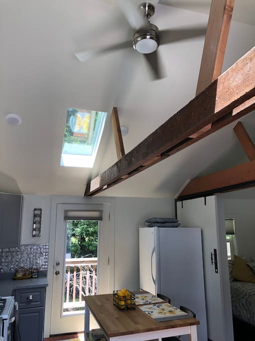 Open beam construction and skylights add to the bright cheeriness of the cottage.
