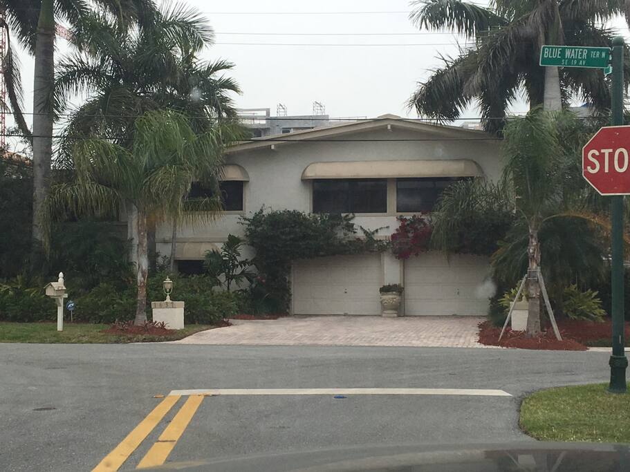 Front of the house large driveway with two car garage