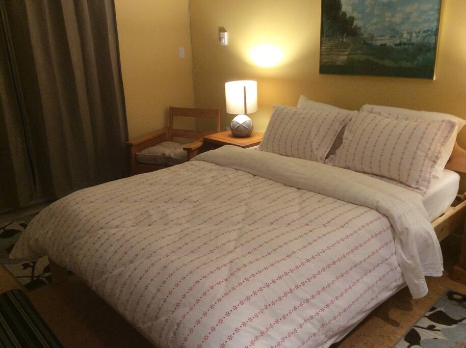 Enjoy a cozy sleep in this queen sized bed perfectly set up for you.