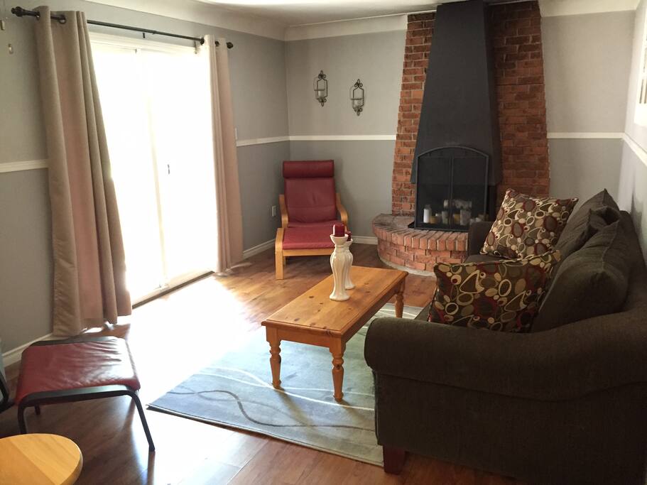 Family room that opens to back deck and large treed yard.