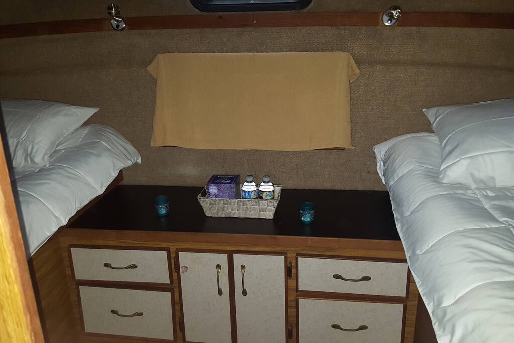 Aft stateroom two single beds. Towel covering mirror for pictures. Ear plugs will be supplied for light sleepers. We share the marina with working boats, and they work nights occasionally.