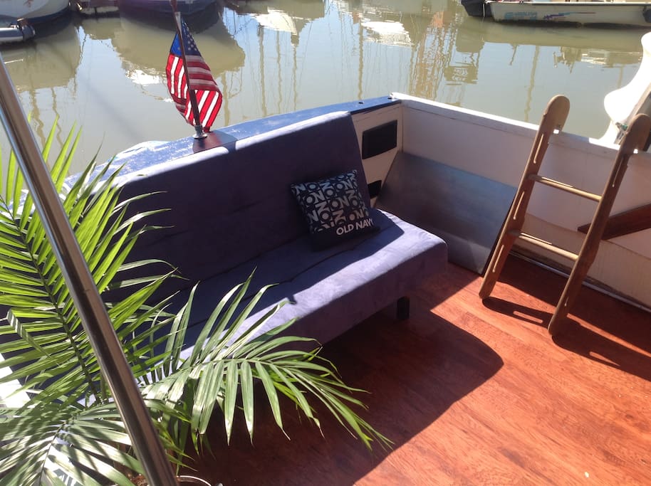Pilothouse/Deck with sofa and BBQ.