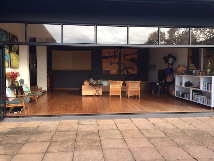 big open doors lead from lounge to verandah