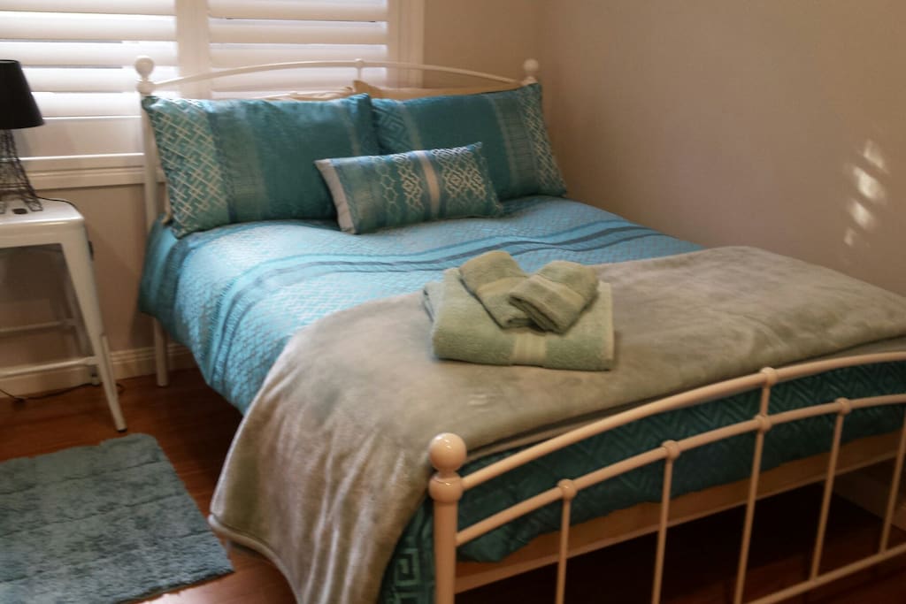 Comfy double bedroom next to bathroom