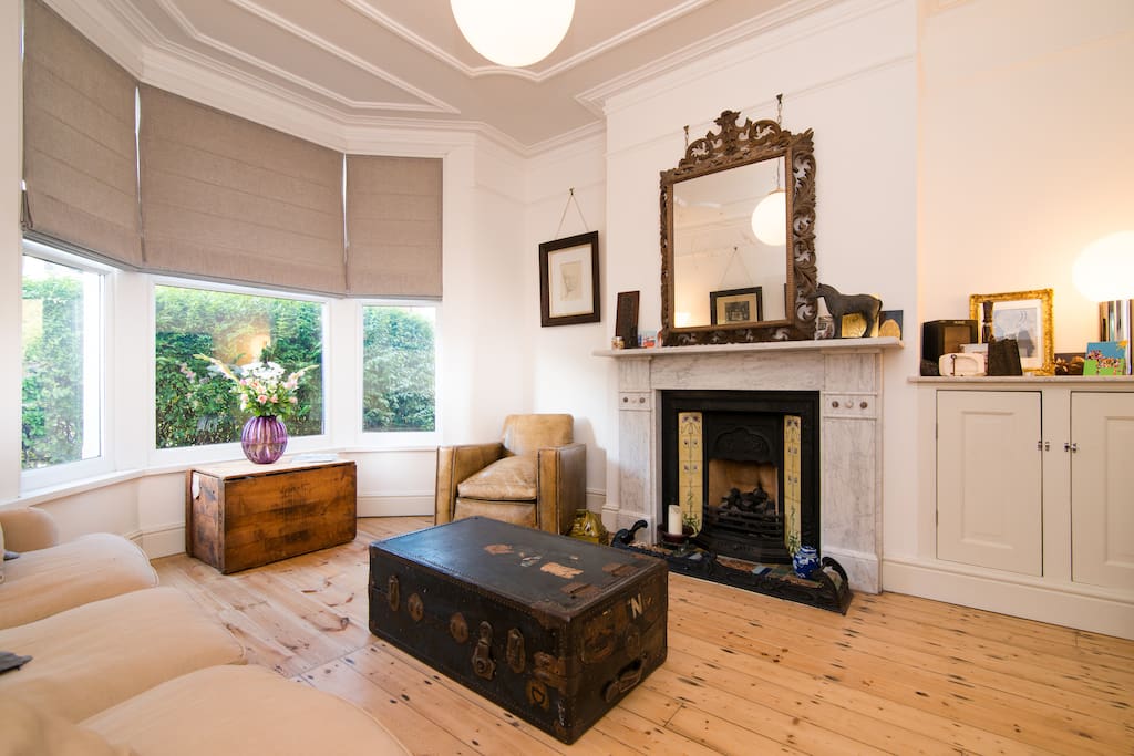 Comfortable sitting room with traditional Victorian features and furniture.