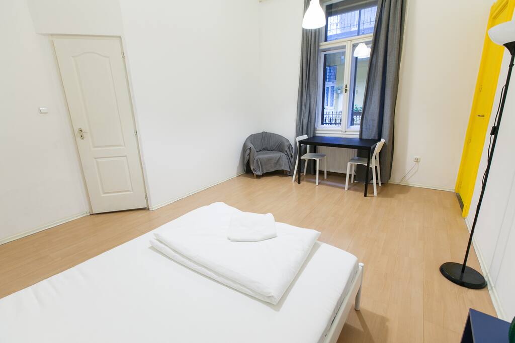 Bedroom 1 with a king size bed and a table