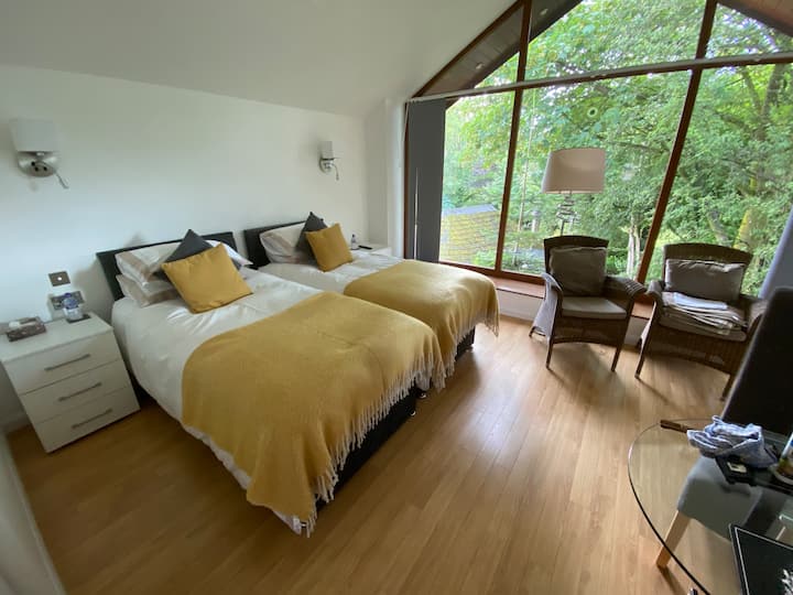 Comfortable twin beds with fantastic garden views