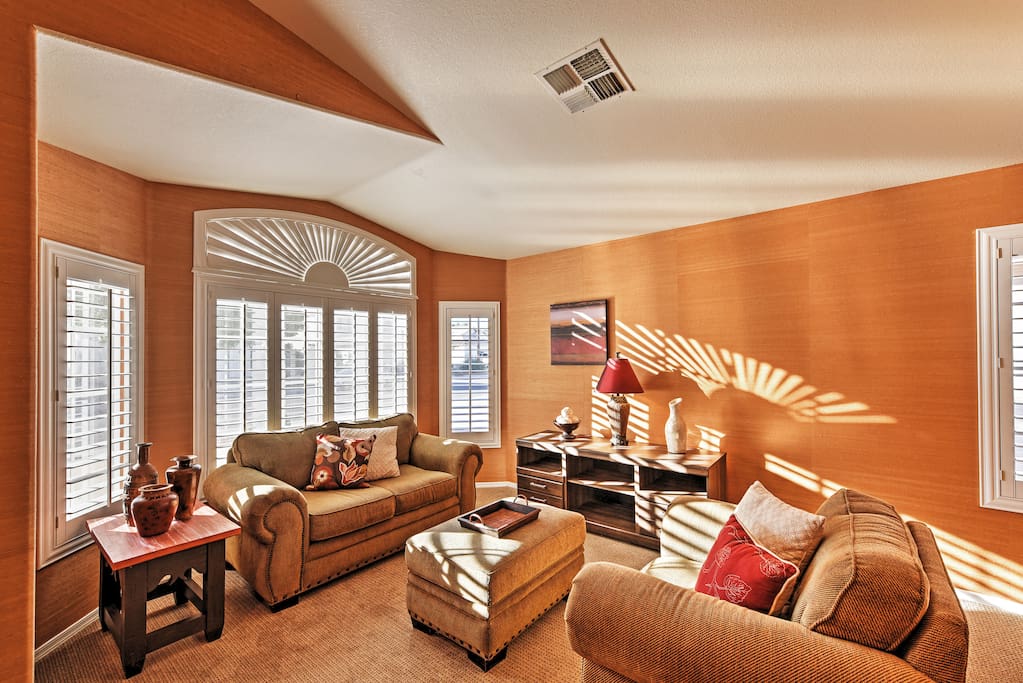 The sun peeks through into the spacious living room to help you feel at home.