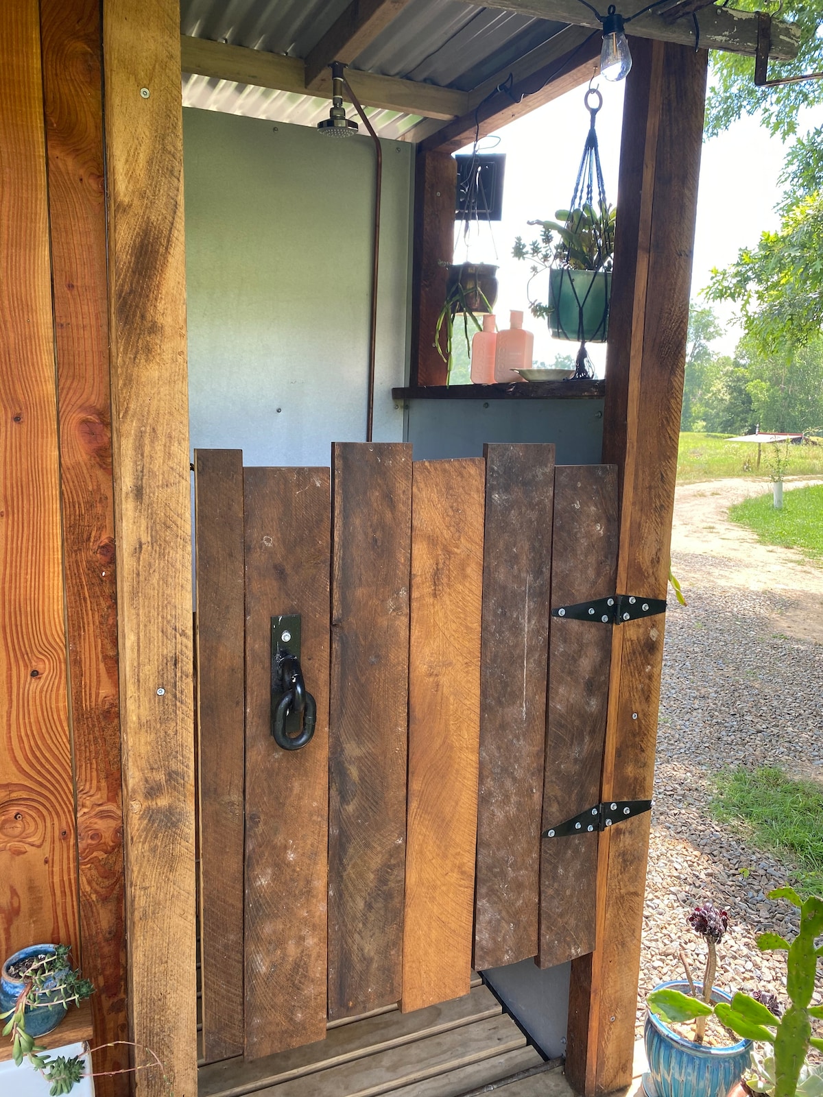 Semi outdoor shower with wonderful views at Lone Oak Eco Cabin in Okoroire