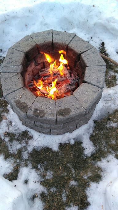 Fire pit and bundle of wood included.