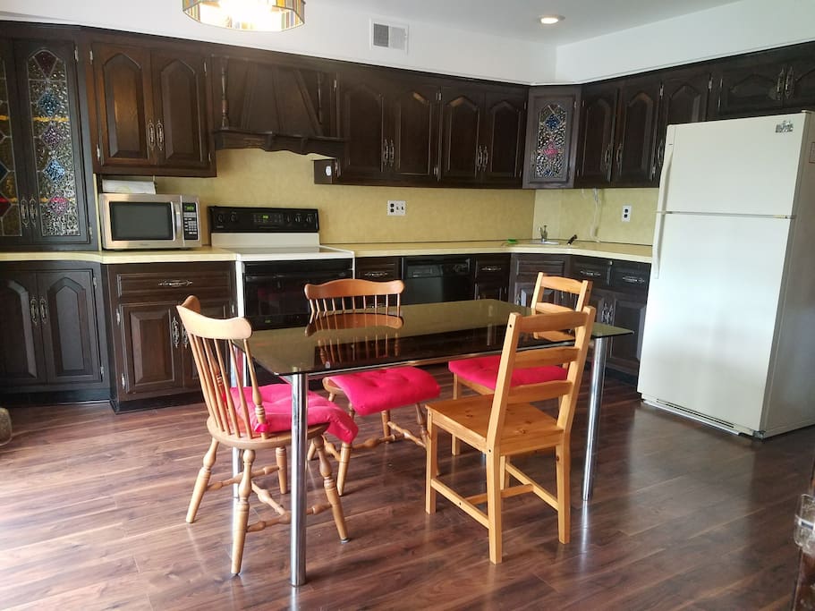 Full private kitchen with utensils and pots and pans for cooking.