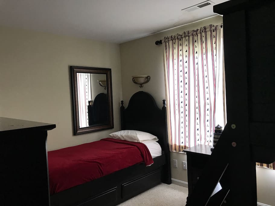 Main Floor 3rd bedroom with a twin size bed with a pull out twin trundle bed.