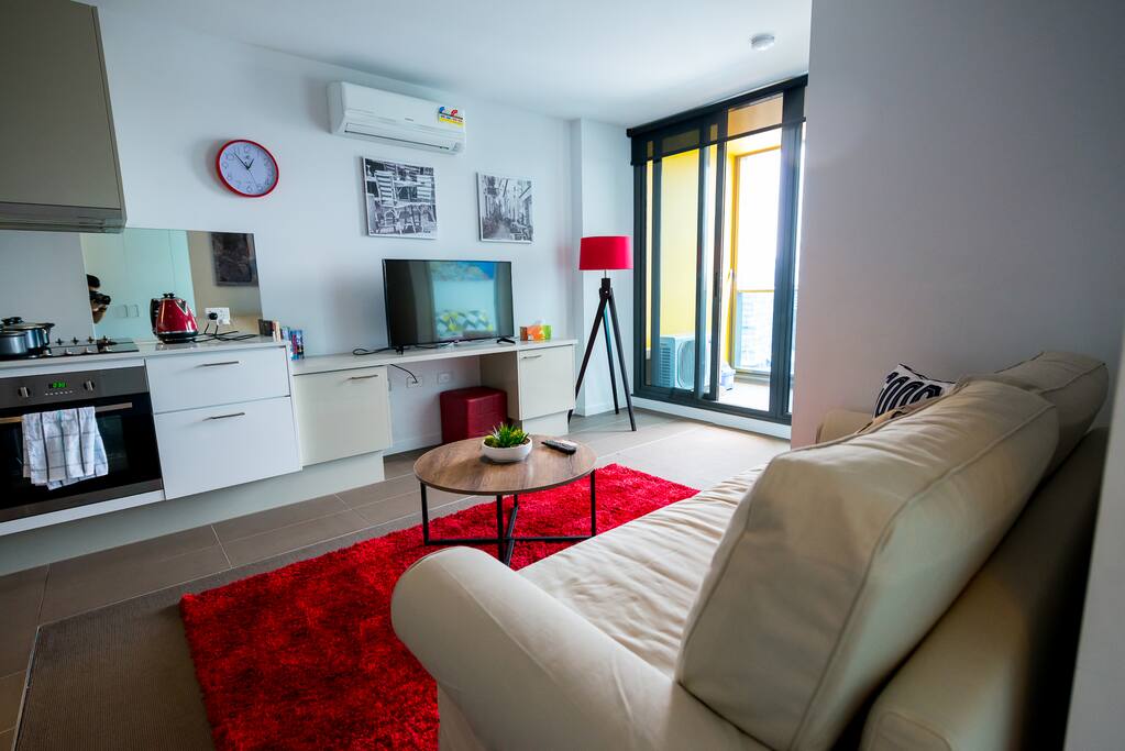 A comfy living area with a 43 inch TV.