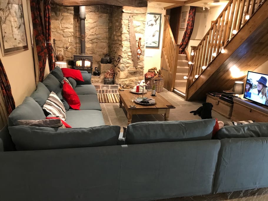 A large L-shaped sofa with room to accommodate the whole family, and the logburner to bring endless warmth and cosiness after a cold coastal walk or for an evening in.